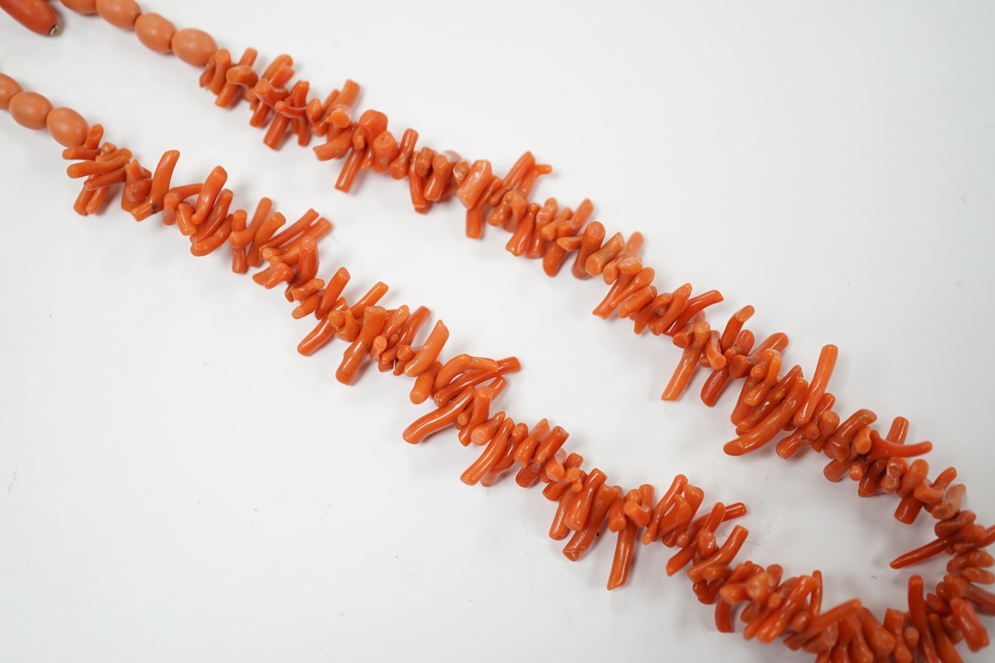 A single strand coral bead and branch necklace, with 375 clasp, 42cm, together with a pair of yellow metal and two stone coral bead drop earrings. Condition - fair